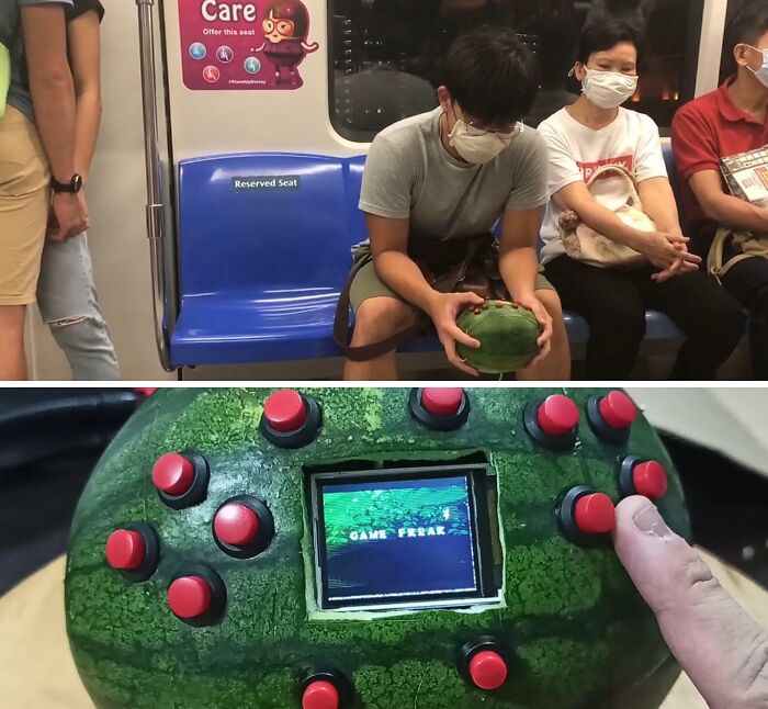 A man on a train playing a game on a playable watermelon console, showcasing creative DIY projects.