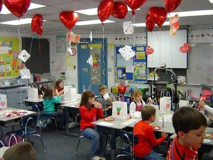 A elementary classroom decorated with red balloons, showcasing nostalgic images of childhood