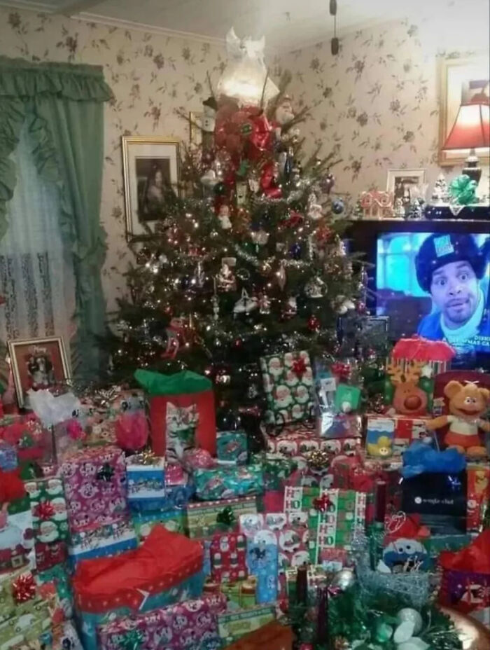 A living room filled with nostalgic images of Christmas gifts under a decorated tree from a 90s kids childhood