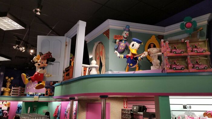 Mickey Mouse and Donald Duck displays at a Disney Store, showing nostalgic images of the 90s