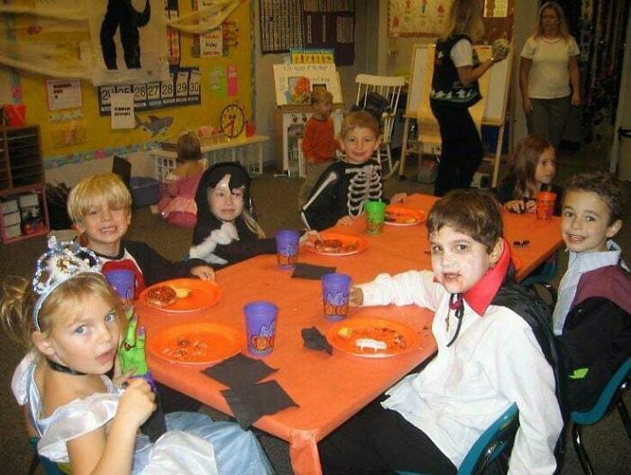 Nostalgic images of kids in Halloween costumes at a school party table in the 1990s.