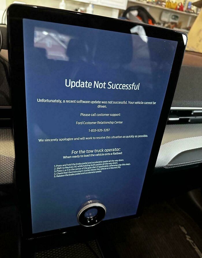 A failed software screen in a car highlights challenges of modern life in America.