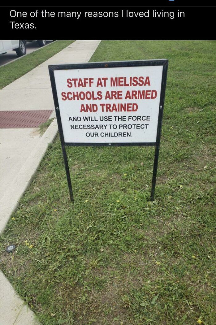 An armed staff sign outside a school in Texas reflecting modern life in America.