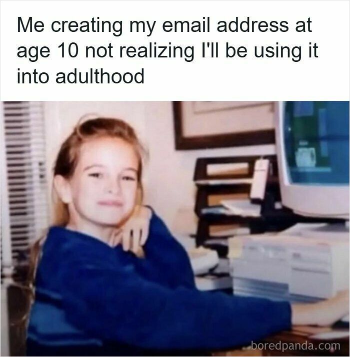 A young girl sitting at an old desktop computer, bringing back nostalgic memories for 90s kids.