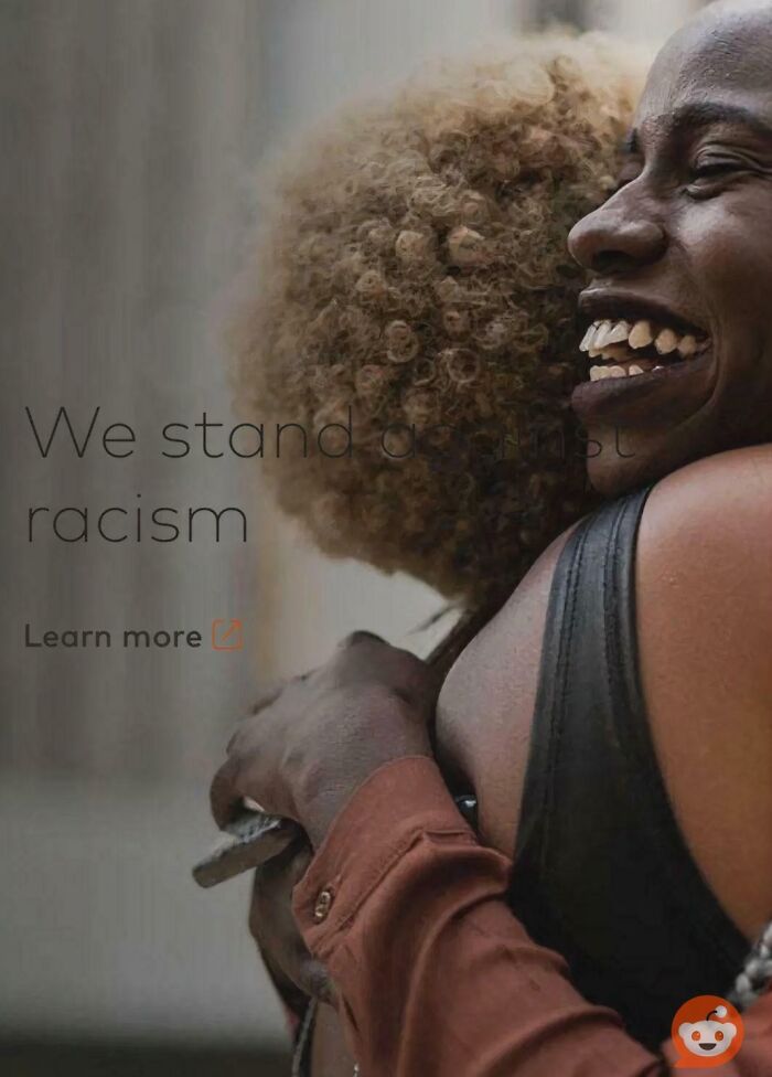 An anti-racism ad with bad contrast reading We stand against racism, showing a corporate fail.