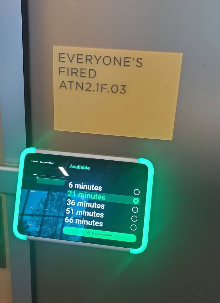 An office meeting room labeled Everyone is Fired, trying too hard to be edgy and cool.