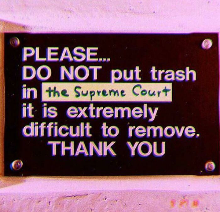 A sign warning not to put trash in the Supreme Court, highlighting a clever act of vandalism.