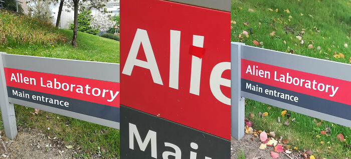 A sign edited with red tape to read Alien Laboratory, showing a funny act of vandalism as public art
