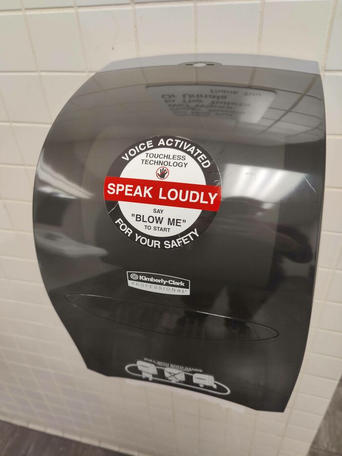 A prank sticker on a hand dryer, an act of vandalism