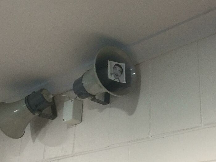 A picture of Mr. Bean inside a loudspeaker, clever vandalism