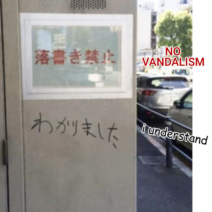 A hand-written reply under a sign in an act of vandalism