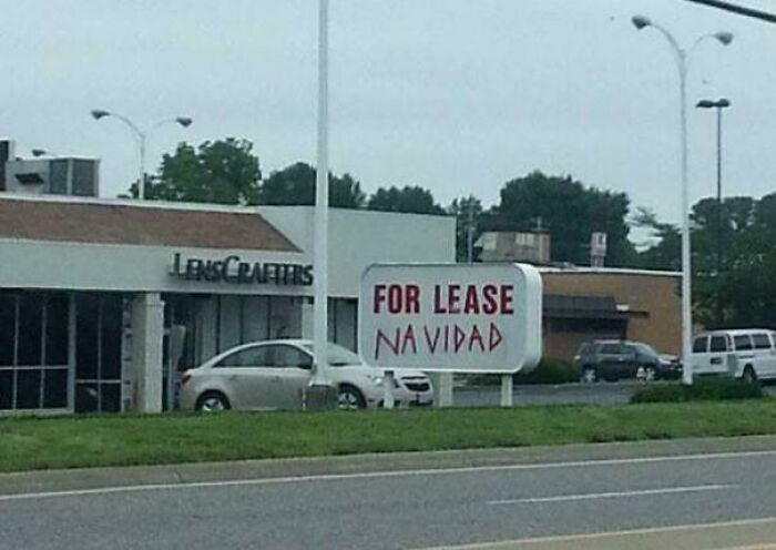 Funny street sign vandalism showing For Lease Navidad, demonstrating clever public art.