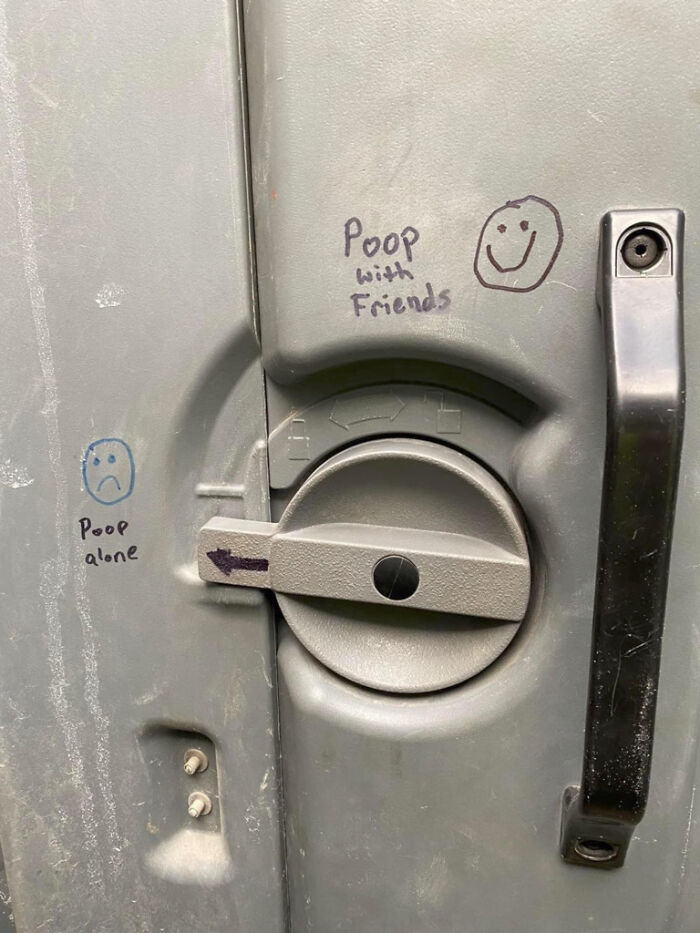 Public art vandalism on a public toilet lock indicating P**p with Friends and P**p alone.