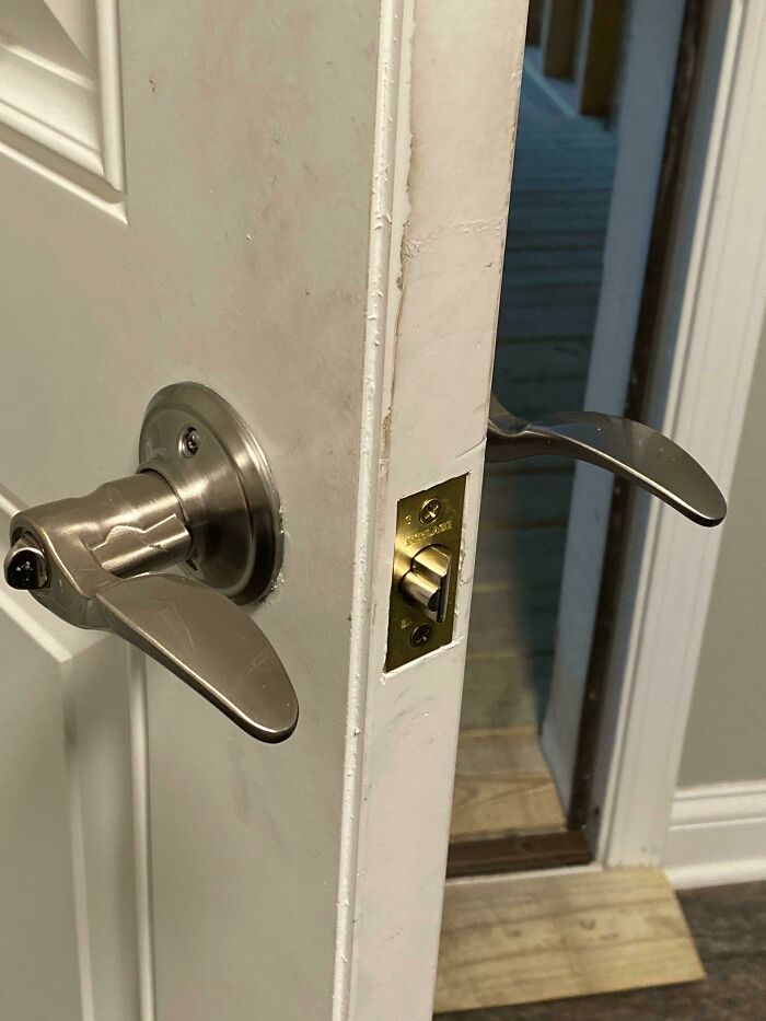 A backwards installed door handle showing a bad home renovation job.