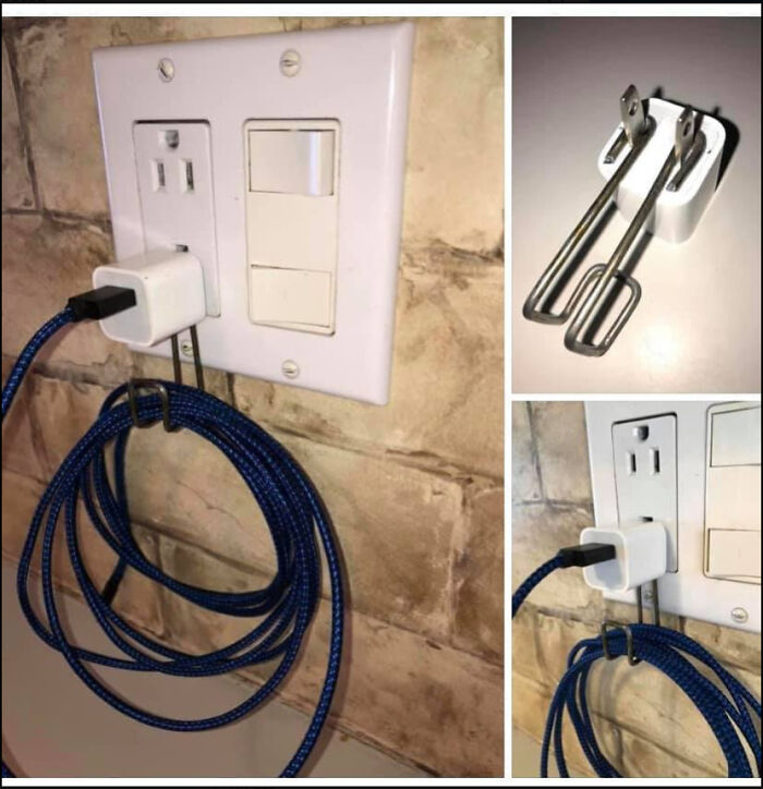 A dangerous DIY wall plug phone holder made with a metal binder clip, showing a complete fiasco.