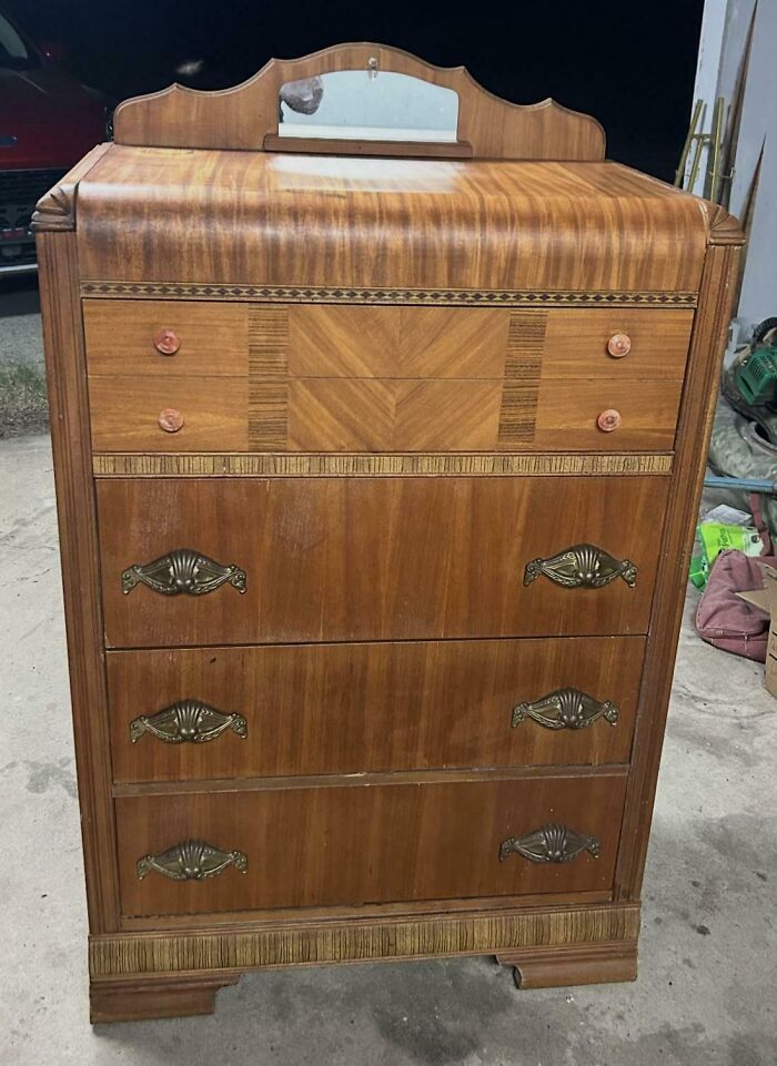 An art deco style wooden dresser, a unique thrift store find.