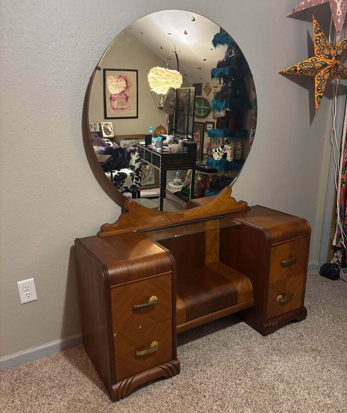 A vintage wooden vanity dressing table with a large round mirror, a great secondhand find.