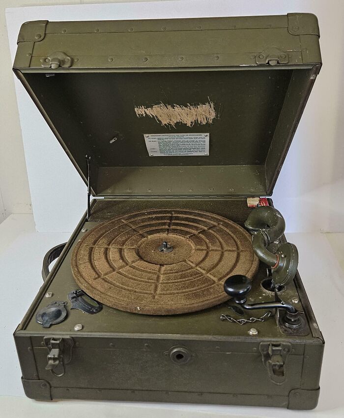 An old green military style portable record player, a rare antique thrift store find.