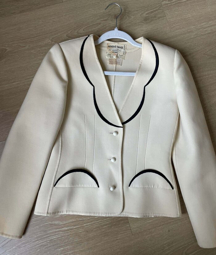 A chic Andre Laug cream-colored vintage blazer, showcasing high-quality thrift store finds