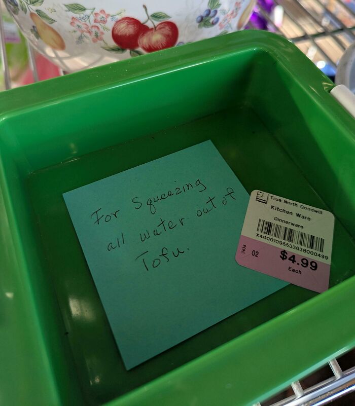 A green plastic tofu press, one of the unique thrift store finds with a handwritten note inside