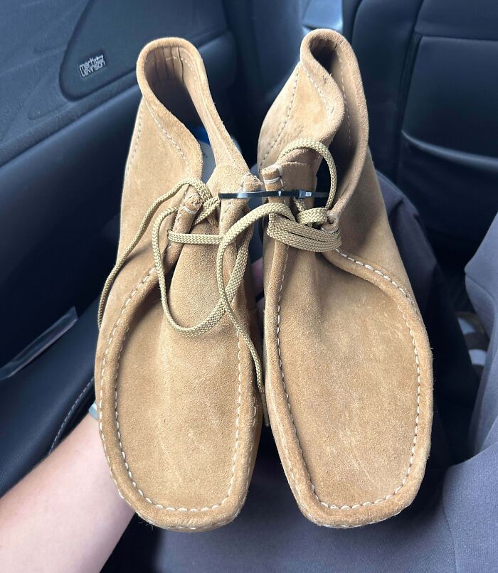 A pair of classic tan suede Wallabee shoes found among thrift store finds.