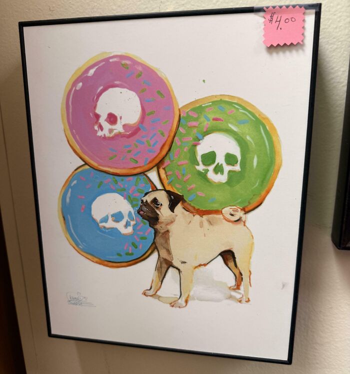 Framed painting of a pug dog standing with decorated donuts as a unique thrift store find