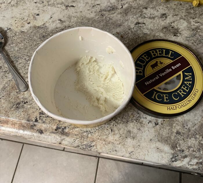 An almost empty tub of vanilla ice cream left in the freezer, featuring relatable roommate stories.