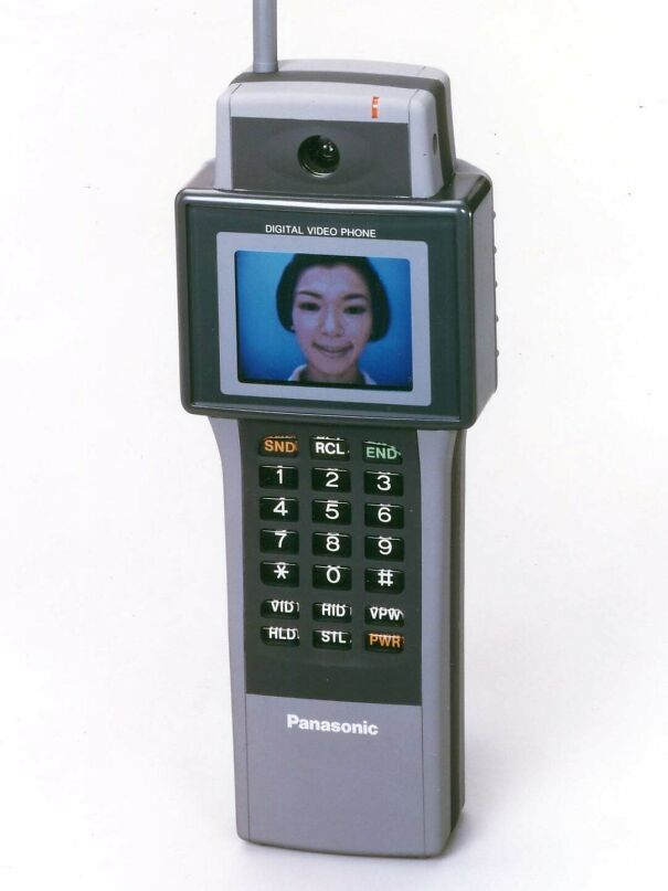Vintage tech Panasonic digital video phone with antenna showing woman on screen