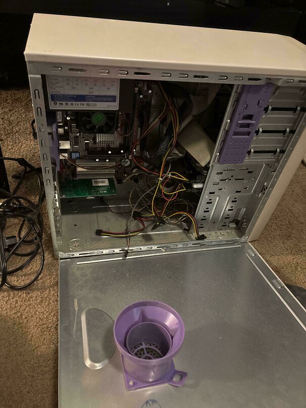 Inside of an old open computer tower showcasing vintage tech hardware