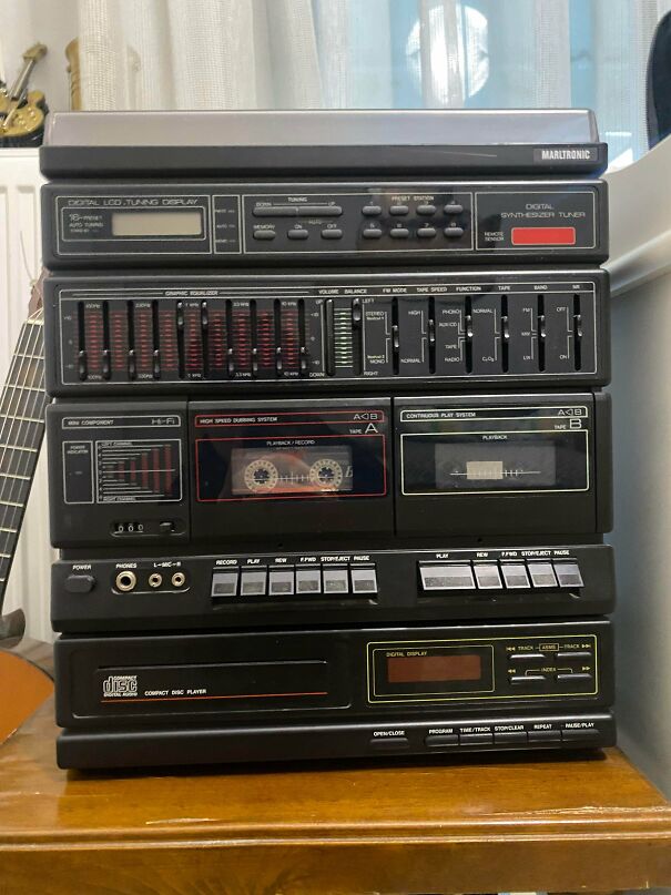 A black Marltronic cassette player system representing classic vintage tech