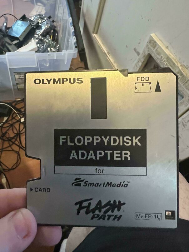 An Olympus floppy disk adapter for SmartMedia representing vintage tech finds