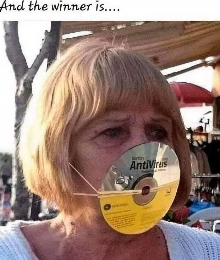 A woman wearing an antivirus CD on her face, showcasing bizarre Karen behavior as a mask.