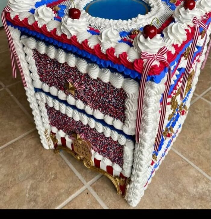 A creative yet bizarre craft project of small drawers decorated to look like a cake with icing and cherries.