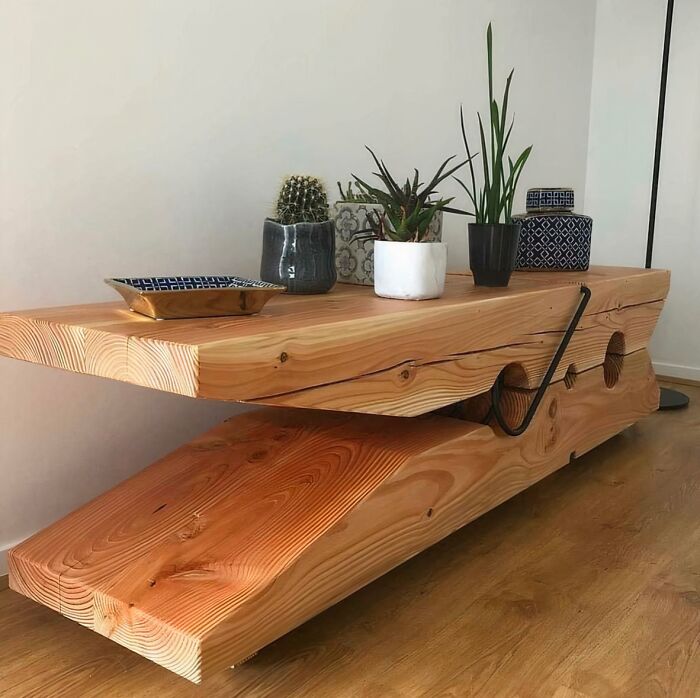 A giant clothespin coffee table displaying unique wooden creations in a living room