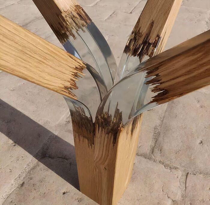 A modern table base featuring split wood joined together with clear resin, showcasing clever wooden creations