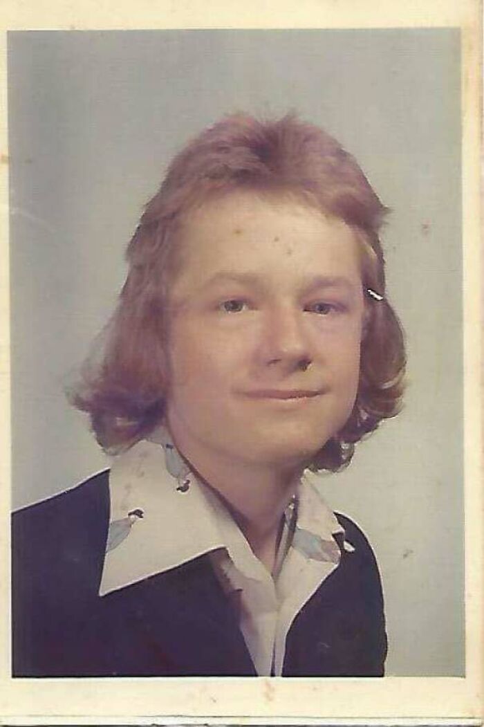 1970s school portrait of a young man with classic hairstyle and collared shirt