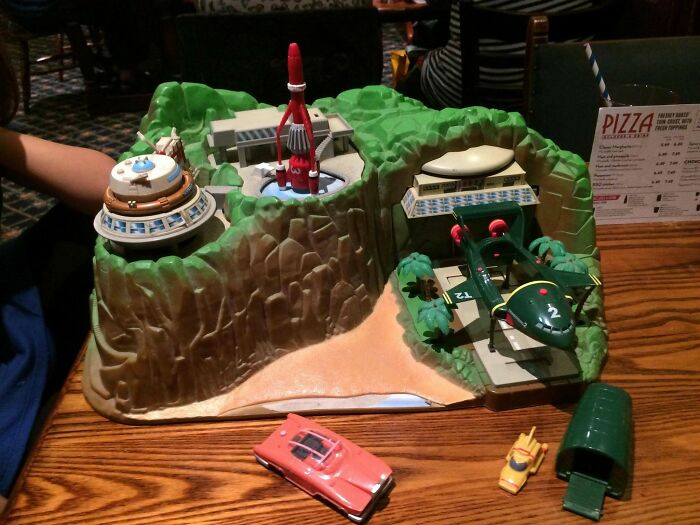 Retro 70s Thunderbirds toy playset with vehicles on table