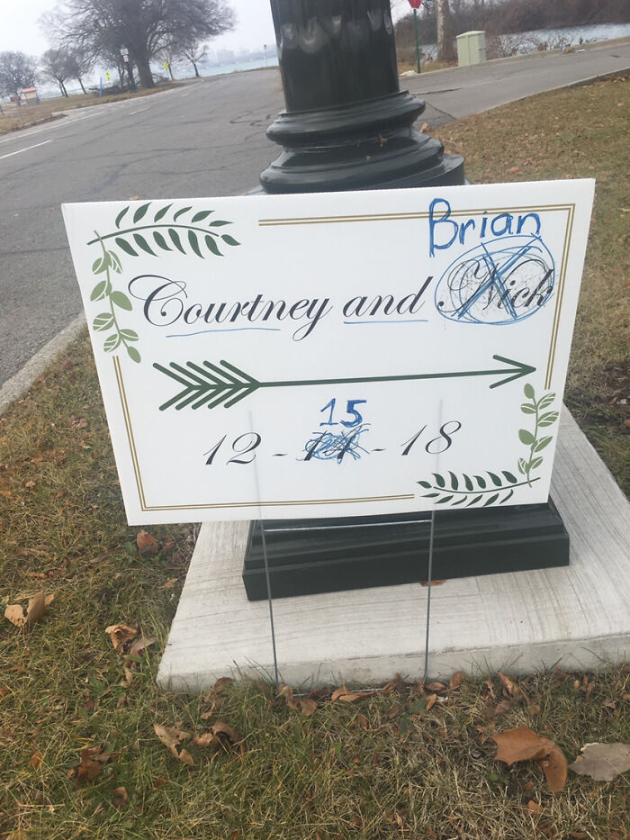 A wedding sign with names and dates crossed out and rewritten, highlighting questionable wedding moments.