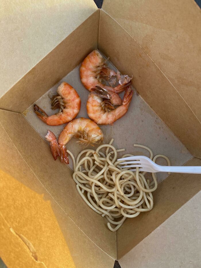 A sad noodle and shrimp meal representing questionable wedding moments catering choices