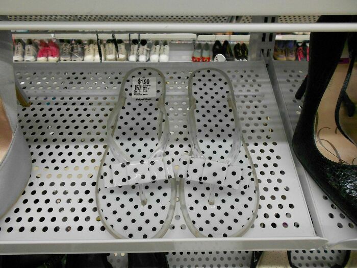 Polka dot sandals blending in with a polka dot shelf in a display of accidental camouflage