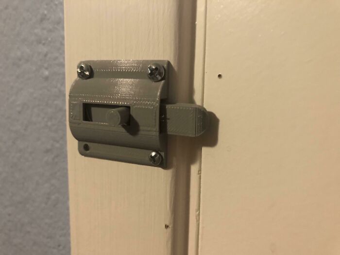 A sturdy, functional sliding door latch replacement made on a 3D printer.