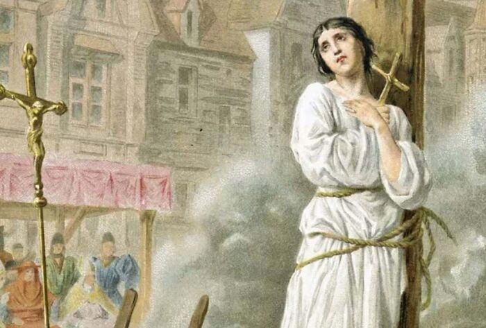 Historical painting of woman tied and threatened with burning at stake depicting strange historical events