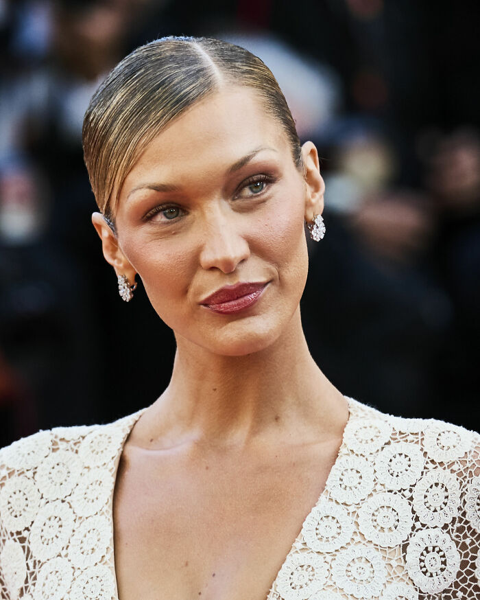 Close-up portrait of model Bella Hadid showcasing her career highlights at a red carpet event