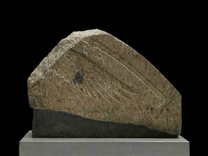 Ancient stone artifact with engraved wing design from strange discoveries