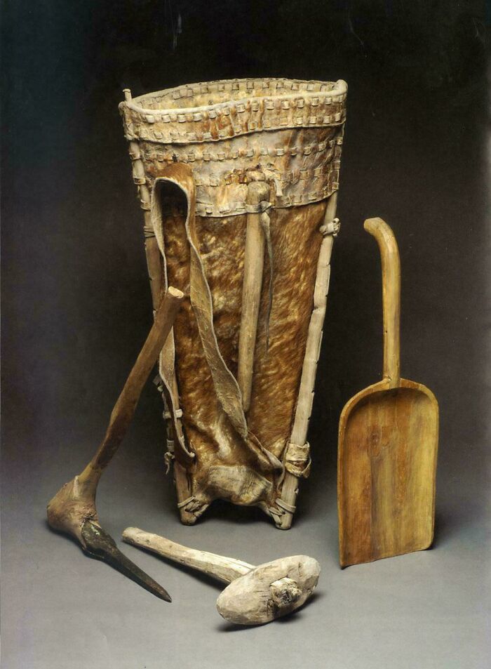 Ancient leather and wood tools artifact including a scoop and pick