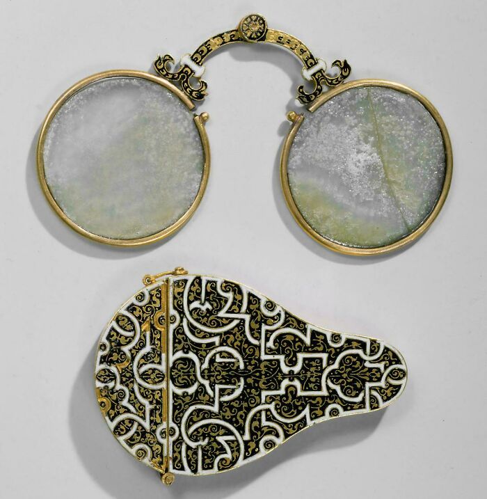 Antique ornate folding eyeglasses with decorative case