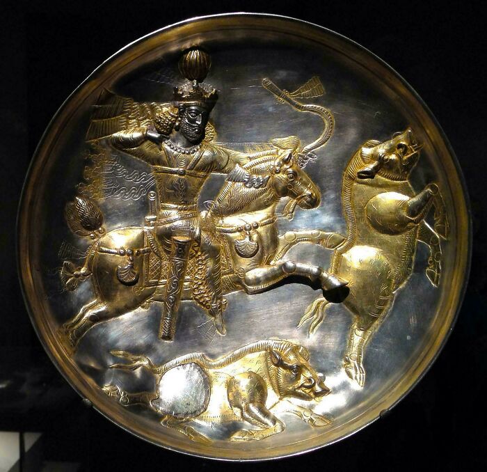 Ancient gold metal plate depicting a warrior on horseback from creepy historical artifacts