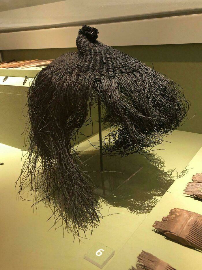 Intricately woven black traditional hairpiece or garment