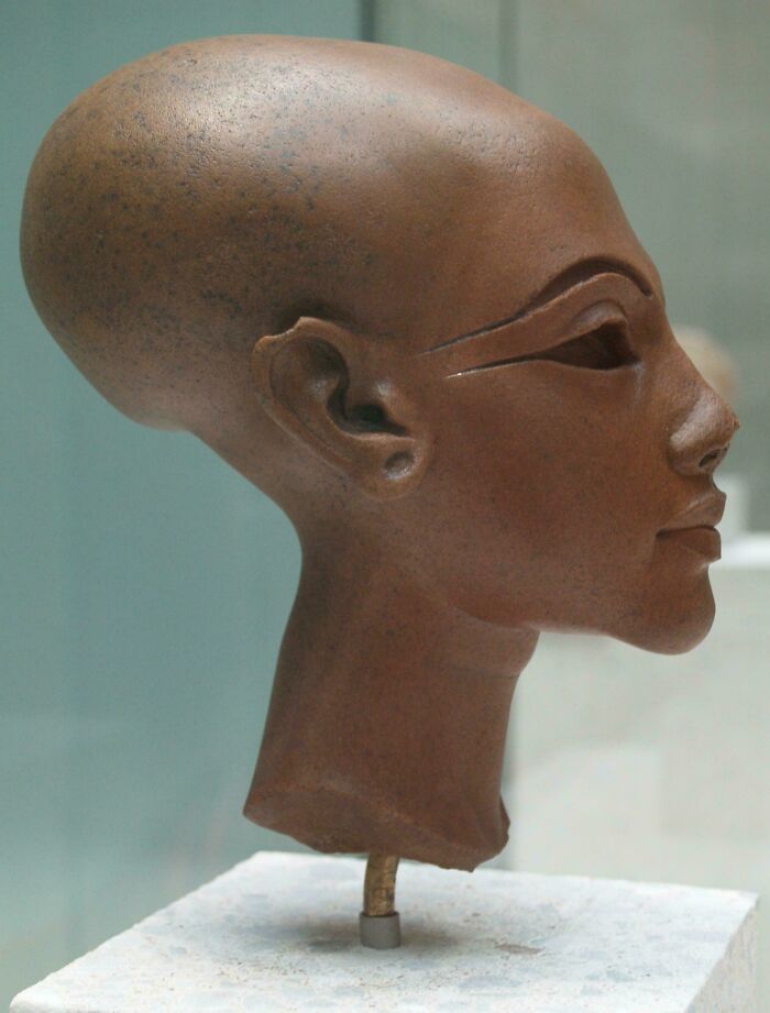 Ancient elongated head sculpture with detailed facial features representing creepy artifacts