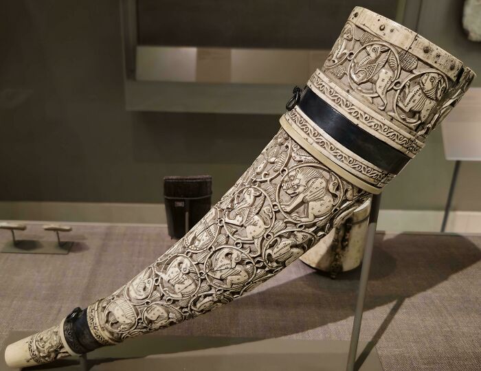 Carved ceremonial ivory horn with detailed animal motifs as an interesting artifact